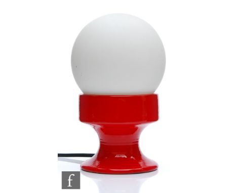 Unknown - A 1970s/80s lamp, the red ceramic glazed pedestal base, with frosted globe shade, height 23cm. 