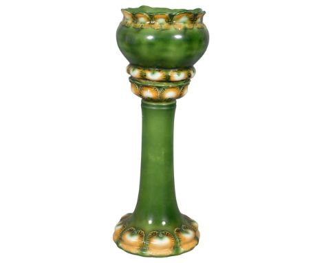 A Burmantofts style glazed ceramic jardiniere on stand. Height 80cm. 