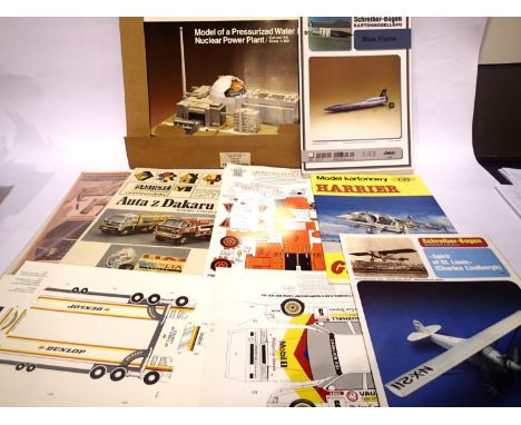Approximately 10 card model kits, cars, aircraft, fire engine and nuclear power plant. All appear complete, unchecked. P&amp;