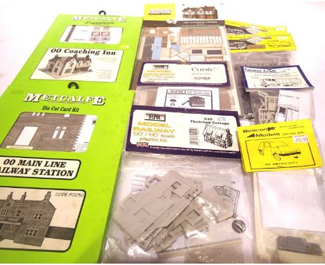 Nine card/plastic OO scale building and accessory kits including coaching inn, station, cottages, signal box, vehicles etc. A