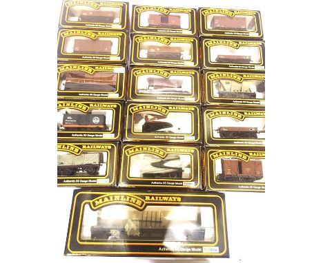 Sixteen Mainline boxed wagons; brake, bogie bolster, van, tanker, hopper etc. P&amp;P Group 2 (£18+VAT for the first lot and 