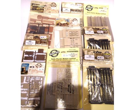 Nine ratio OO scale accessory packs; telegraph poles, fencing hut, coal depot, signals etc. Mostly appear as new, in packets.