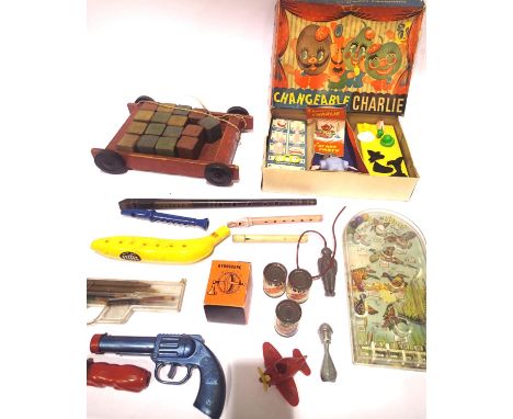 Selection of vintage toys and games including; pull along wooden block truck, five whistles, includes Clarke Tin Whistle Manc