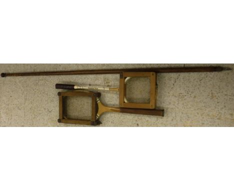 A vintage tennis racquet, badminton racquet and a hiking stave in pine marked "M. Buckley Lucerne...."