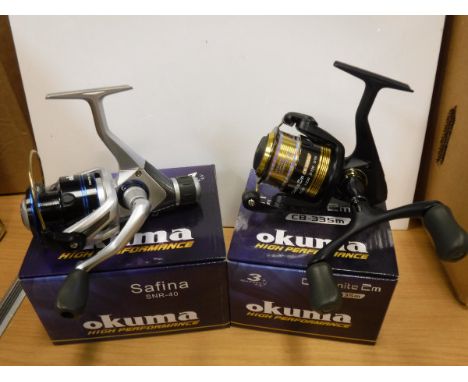 A collection of eight boxed and un-used Okuma fixed spool reels to include five SN-40 reels and three CB-335-M reels