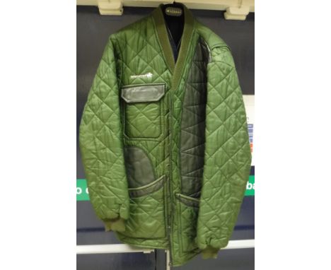 A Winchester shooting coat, together with a "Beretta" shooting waistcoat