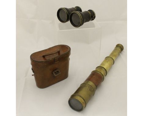 A pair of multi-purpose binoculars with adjustable lenses for "Theatre", "Campaign" and "Marine" with leather outers, housed 