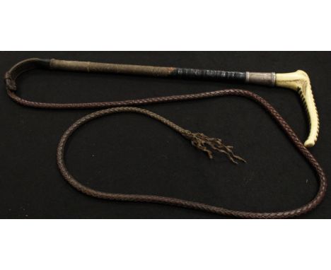 A gentleman's riding crop with antler handle and button inscribed "Callow S Mount Street London" with silver ferrule (marks o