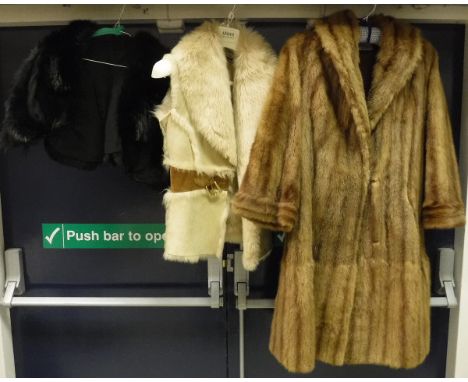 A black fur shrug, together with a Temperley of London sheepskin gilet and a mink coat by A. C Edwards & Sons Limited The Fur