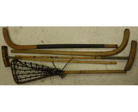 A lacrosse stick, two polo mallets, one by J Grey & Son and one by Salter & Son, together with two hockey sticks   CONDITION 