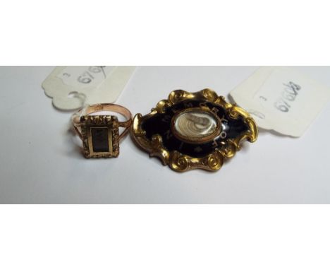 A memoriam brooch, the central hair locket surrounded by black enamel, and a 9ct gold memoriam ring, with hair window, approx