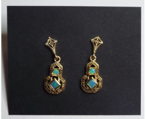 A pair of 9ct gold and opal drop earrings