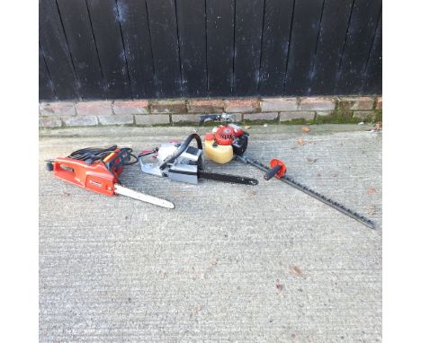A Spear and Jackson petrol chainsaw, together with a Sovereign electric chainsaw and a petrol hedge cutter (3)