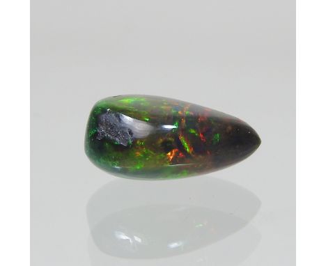 An unmounted pear shaped black opal, approx 5.5 carat