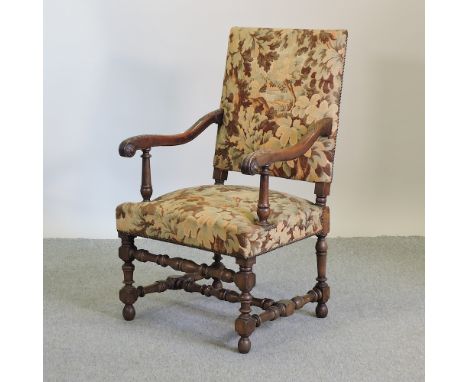 A French 17th century style tapestry upholstered armchair, on turned legs