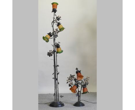 A metal standard lamp, with glass shades, 213cm high, together with a similar table lamp and shades