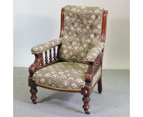 A Victorian floral upholstered button back armchair