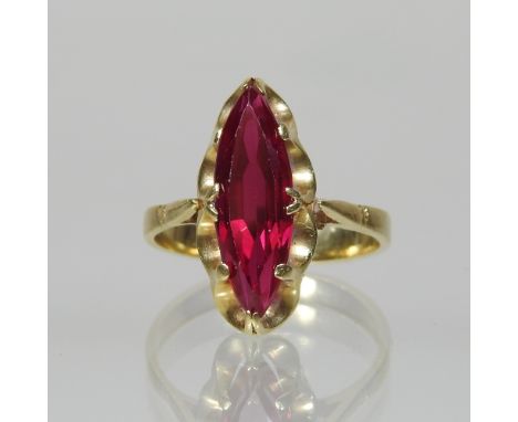 An 18 carat gold and ruby ring, of elliptical design, boxed