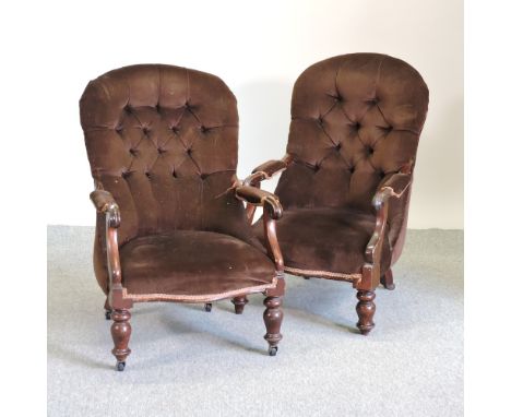 A pair of Victorian brown upholstered button back armchairs