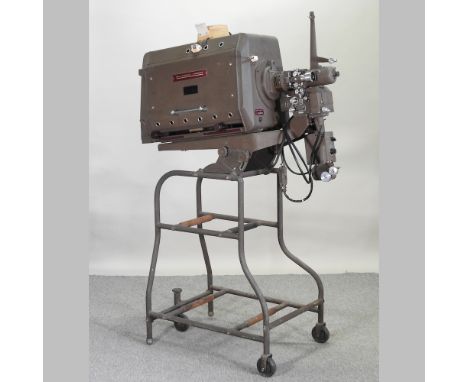 A 1950's Bell &amp; Howell cinema projector, on stand, 170cm high overall