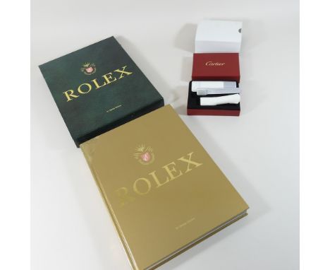 George Gordon, Rolex, first edition book, together with a Cartier watch cleaning set, cased