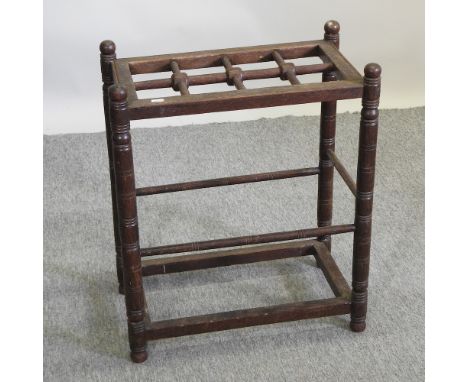 An Arts and Crafts oak stick stand, 54cm