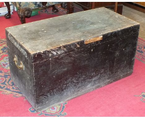 A stained pine tool box fitted with trays and brass carrying handles, 95cm wide, together with a newel post, a circular table
