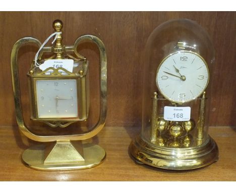 A mid-20th century gilt metal cubic weather station on oval stand with hinged side panels for barometer, thermometer, 8-day c
