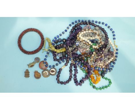 Four freshwater pearl necklaces, two amethyst bead necklaces, a malachite bead necklace and other bead jewellery.
