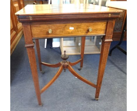 Jas Shoolbred & Co, an Edwardian rosewood and marquetry envelope card table.
