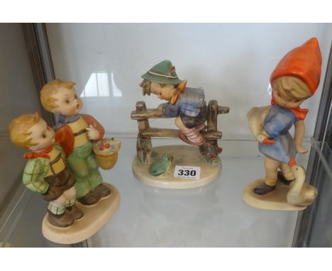A Goebel Hummel figure of `Retreat to Safety`, 15cm high, and two other large Hummel figures (3)