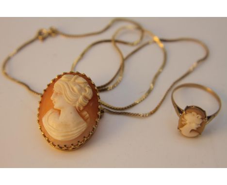 A 9 carat yellow gold set carved shell cameo brooch and ring. The carved cameo brooch with pierced gallery is on a 9 carat ye