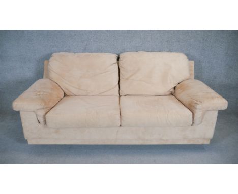 A contemporary two seat sofa in faux suede upholstery. H. 90 W. 205 D. 100 