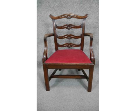 A Georgian mahogany ladder back armchair with drop in seat on square stretchered supports. H.66 W.46 D.34cm 