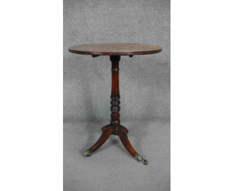 A 19th century mahogany occasional table on ring turned central column resting on swept tripod base. H.74 Dia.53cm 