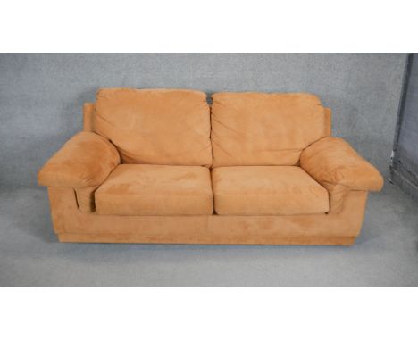 A contemporary two seat sofa in faux suede upholstery. H. 90 W. 205 D. 100 