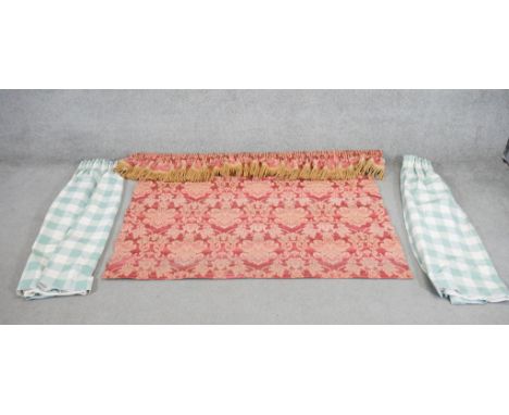 A red and gold foliate design silk mix venetian blind with pelmet along with a pair of green and white gingham curtains. L.86