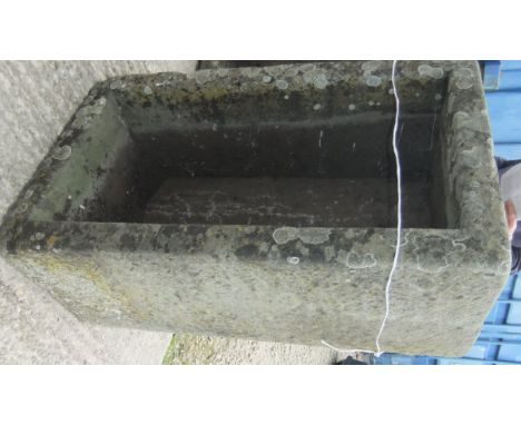 A rectangular stone trough 