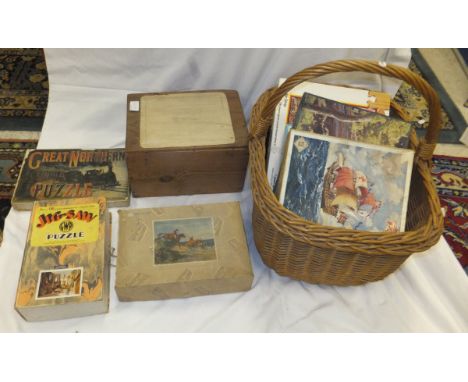 Three crates containing a collection of vintage wooden and other jigsaw puzzles, to include a
"Great Northern Puzzle" by E Wo