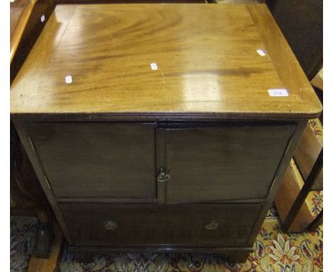 A 19th Century mahogany commode chest, the two doors above a single drawer on bracket feet