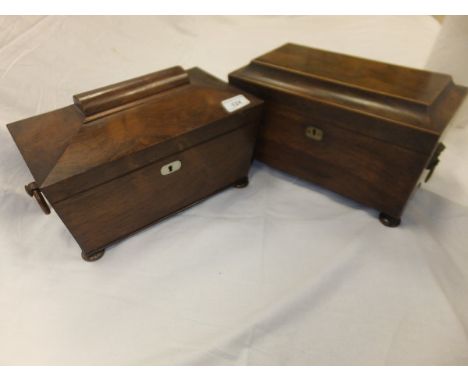 A Victorian rosewood sarcophagus tea caddy and a Victorian rosewood tea caddy with boxwood stringing