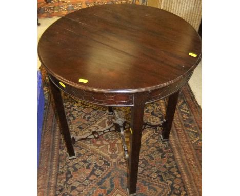 An mahogany occasional table in the Chippendale taste, the circular top above a moulded frieze, raised on four square legs to