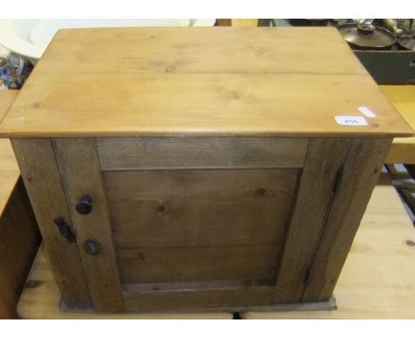 A pine food safe with single door opening to reveal a shelf