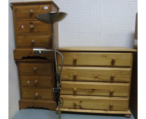 A pair of modern pine three drawer bedside chests, together with a modern pine chest of four long drawers raised on bun feet 