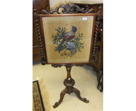 A Victorian rosewood pole screen, the beadwork panel with exotic bird amongst blossom, flanked by barley-twist supports, rais