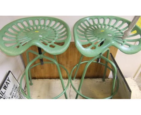Two tractor seat bar stools *