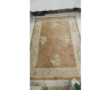 A Chinese superwash carpet in shades of pale terracotta, cream and pale blue, 200 cm x 138 cm