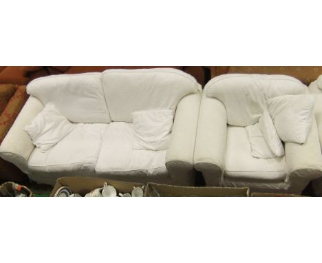 A modern scroll arm two seater sofa with cream loose covers, together with a matching smaller sofa, an armchair and a footsto