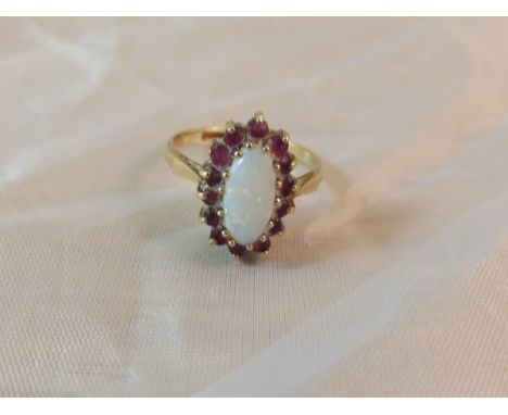 A 9 carat gold opal and ruby set dress ring