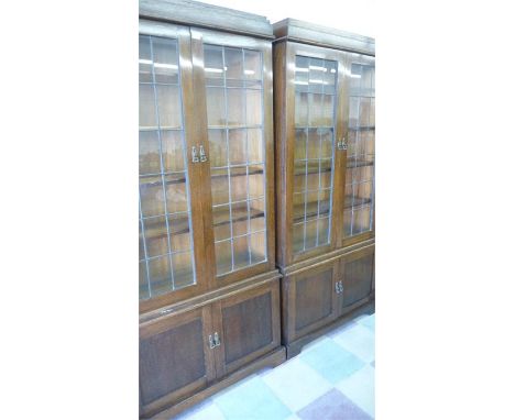 A pair of oak bookcases with leaded light features- keys in office